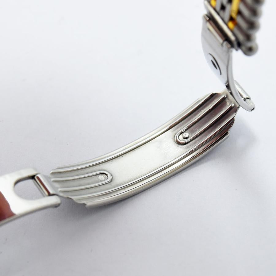 VINTAGE WATCHES FASHIONのカルティエ マストタンク。シルバーとゴールドのコンビネーション、ローマ数字インデックス、ブルーの針が特徴。ステンレススチールとゴールドのブレスレット。