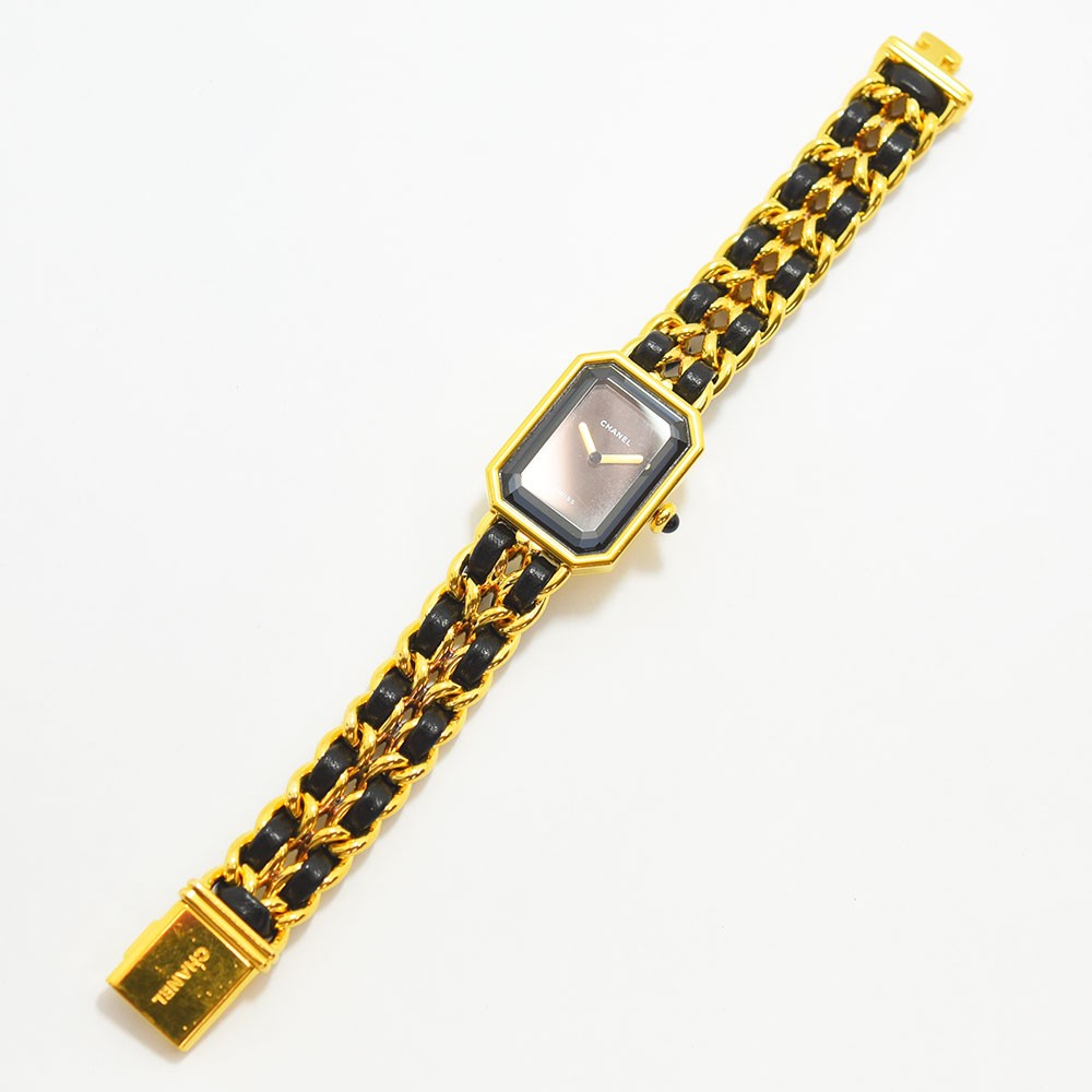 VINTAGE WATCHES FASHIONのシャネル プルミエールウォッチ。ゴールドトーンのケースとブラックレザーを編み込んだチェーンブレスレット。ブラックの文字盤。