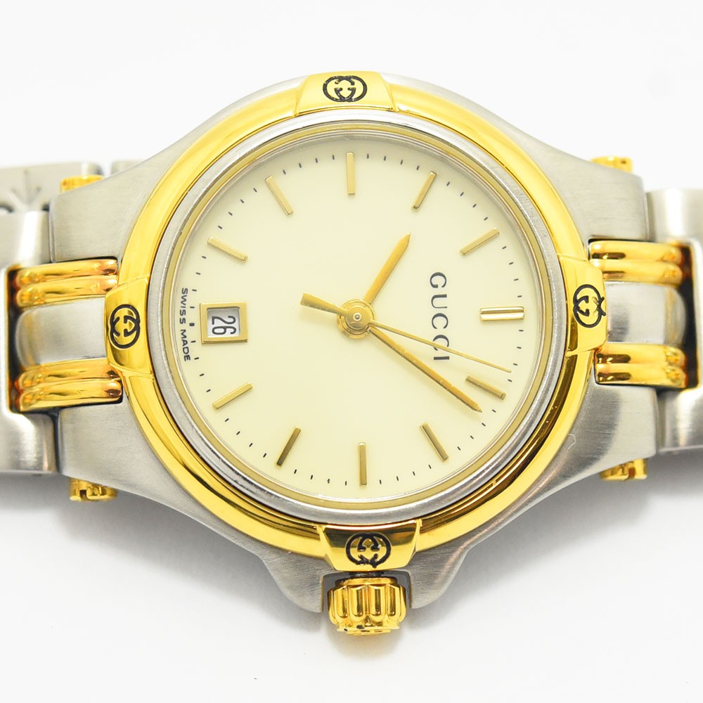 VINTAGE WATCHES FASHIONのGucciレディース腕時計9040L。シルバーとゴールドのコンビネーションカラーのステンレススチール製で、日付表示付きの洗練されたデザイン。