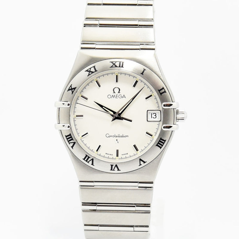 VINTAGE WATCHES FASHIONのOMEGAコンステレーション。シルバーのステンレススティール製ケースとブレスレット、ローマ数字ベゼルが特徴の洗練された腕時計。