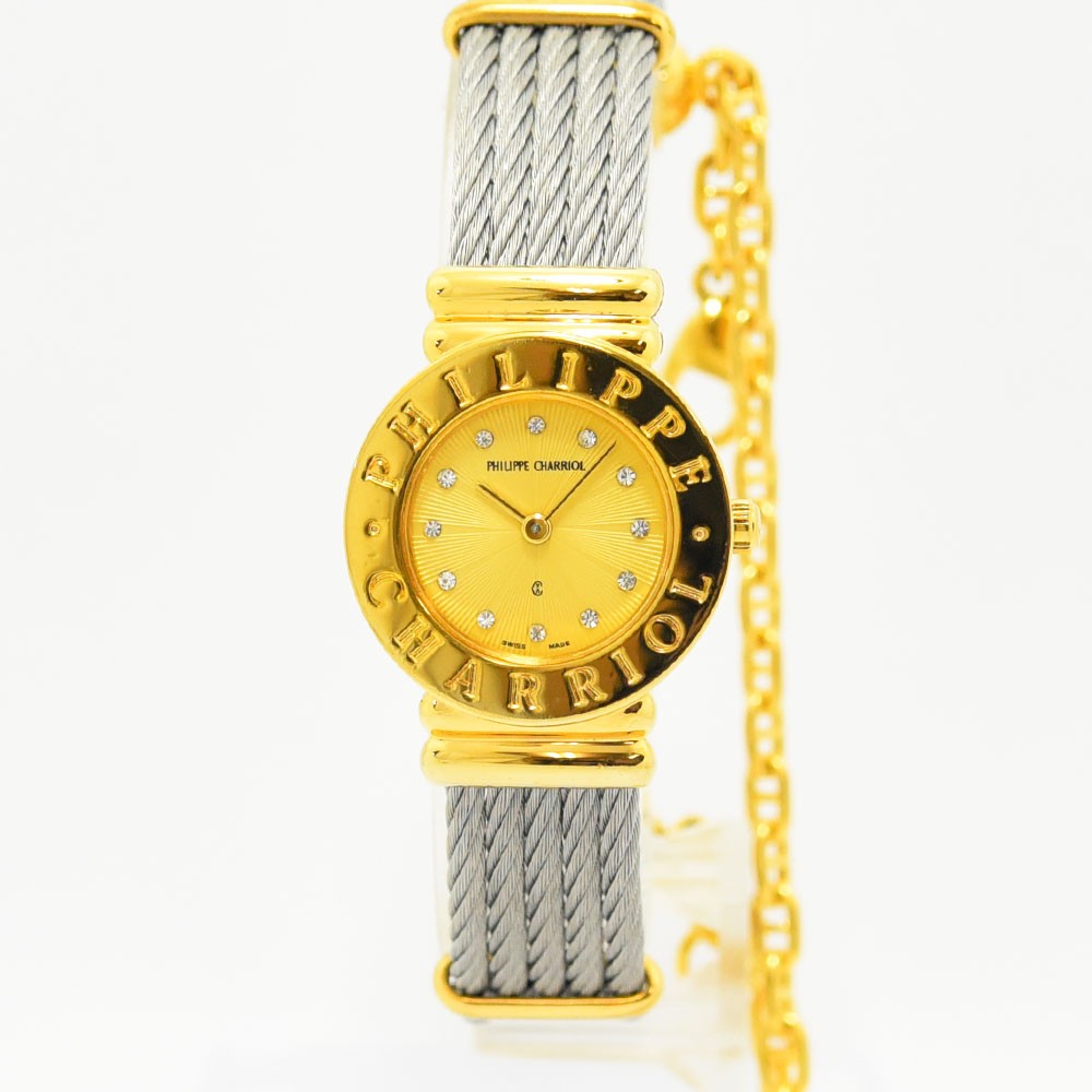 VINTAGE WATCHES FASHIONのフィリップ・シャリオール製レディース腕時計。ゴールドとシルバーのワイヤーケーブルブレスレット、ストーン付き文字盤が特徴。