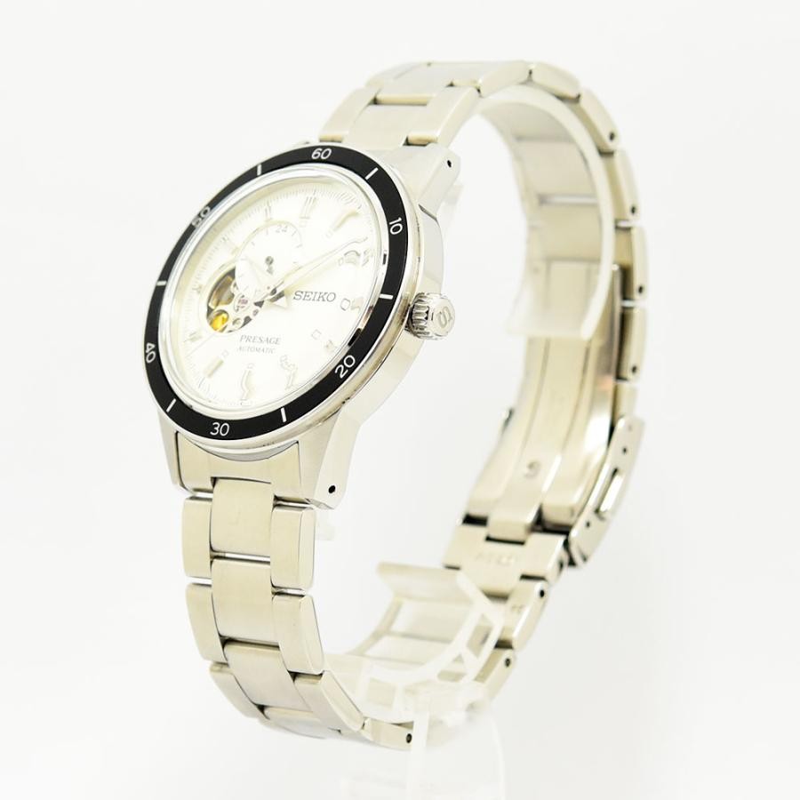 VINTAGE WATCHES FASHION プレザージュ オートマチックウォッチ。オフホワイトの文字盤、オープンハート、ブラックセラミックベゼル、ステンレススチールブレスレット。